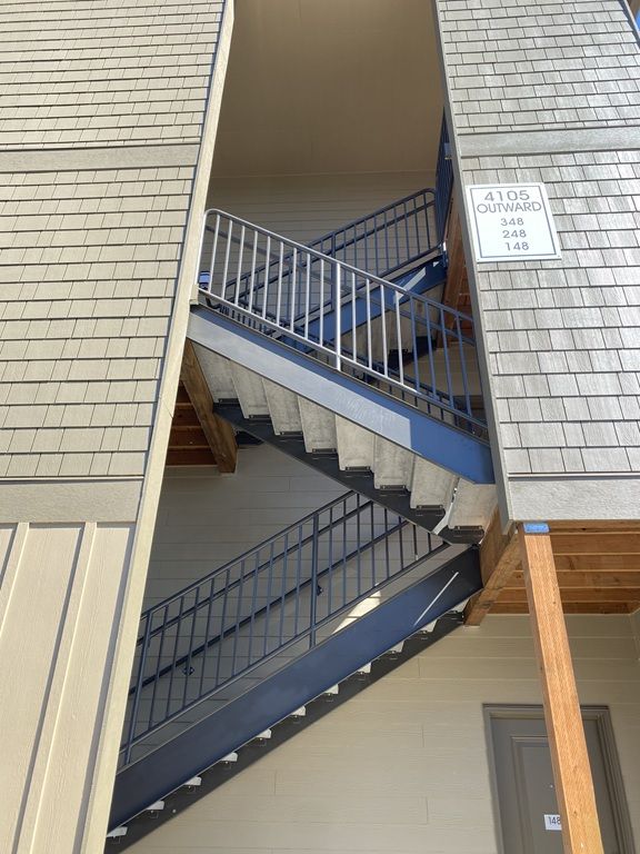 Curved handrail apartment complex ground view Jory